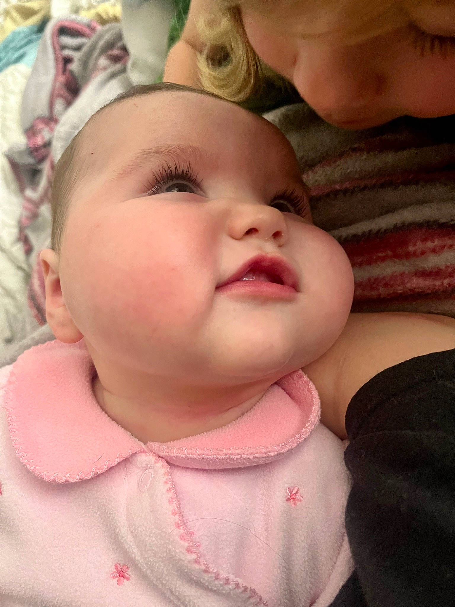 Aubrey is registered to the contest to win money with this photo: baby, baby_toddler_clothing, cheek, eye, eyebrow, eyelash, finger, fun, gesture, happy, head, iris, lip, mouth, neck, nose, person, pink, skin, smile