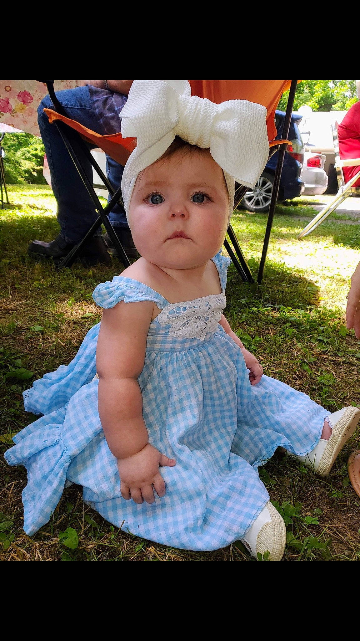 Heidi joined the competition — help win amazing prizes! baby, baby_toddler_clothing, chair, child, event, fun, garden, grass, happy, hat, lap, lawn, pattern, person, pink, plant, recreation, sitting, spring, sun_hat