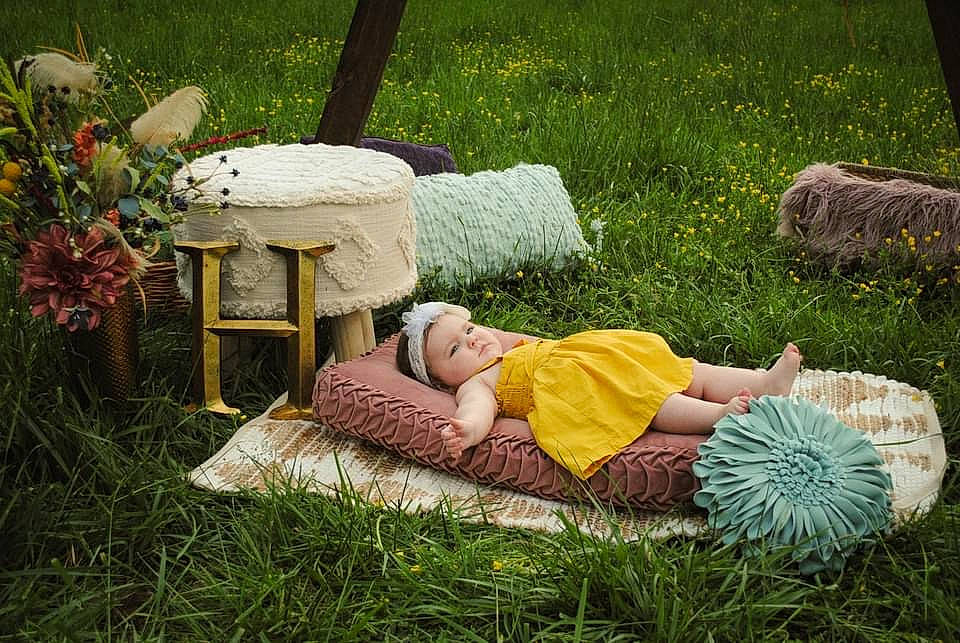 Heidi is registered to the contest to win money with this photo: comfort, event, garden, grass, grass_family, grassland, groundcover, landscaping, lawn, leisure, linens, outdoor_furniture, people_in_nature, person, plant, recreation, shrub, sitting, summer, textile