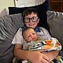 Dexter joined the competition — help win amazing prizes! child, baby, brother, sibling, glasses, blanket, couch, pillow, indoors, smile, holding, family, portrait, happy, young, toddler, casual, home, person, seated