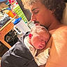 baby, man, curly_hair, sleeping, indoor, close_up, skin, newborn, holding, peaceful, portrait, resting, caring, parent, child, love, family, cozy, shirtless, face