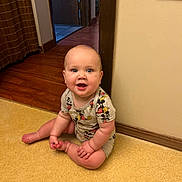 Declan joined the competition — help win amazing prizes! baby, child, sitting, smiling, mickey_mouse, onesie, floor, indoor, wooden_floor, wall, doorway, happy, cute, infant, person, home, room, window, barefoot, plush
