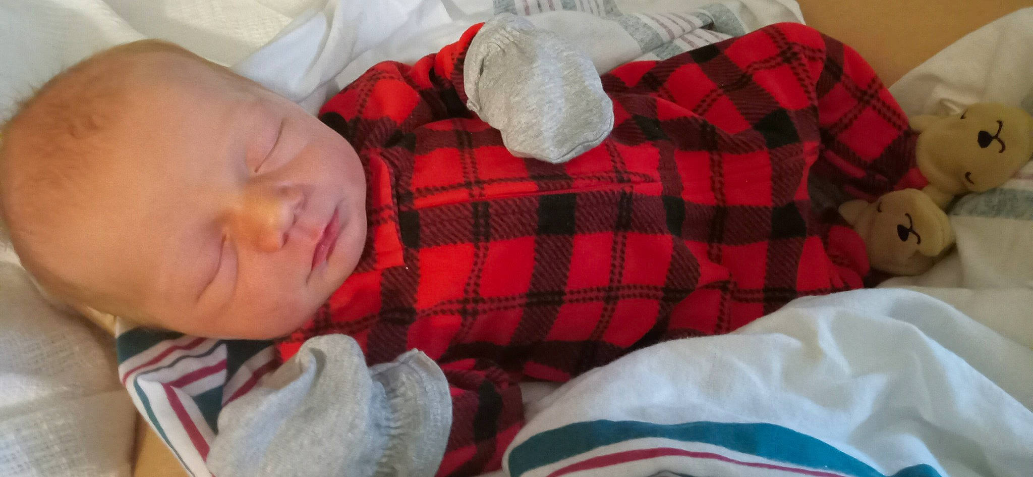 Abel is registered to the contest to win money with this photo: baby, baby_toddler_clothing, bed_sheet, bedding, bedtime, blanket, child, comfort, linens, nap, orange, pattern, person, plaid, room, sleep, sleeve, tartan, textile, toddler