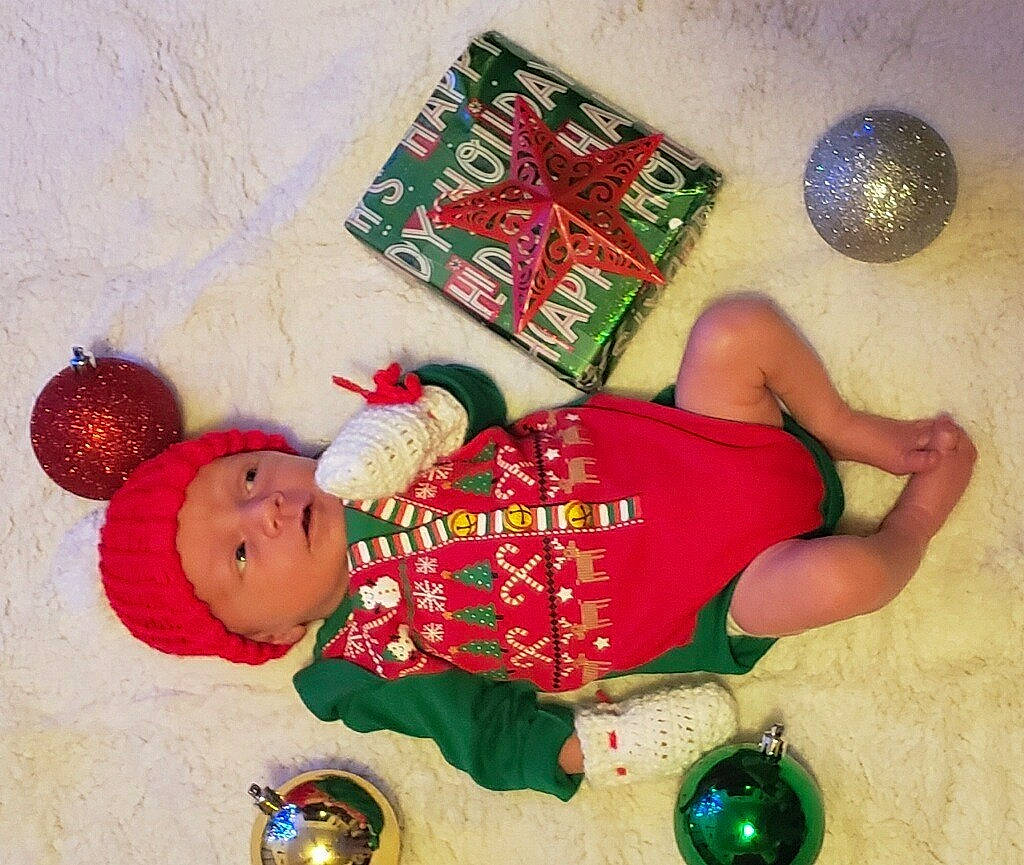 Abel is registered to the contest to win money with this photo: baby, ball, child, event, fictional_character, flooring, fun, happy, hat, headwear, holiday, human_leg, person, play, room, thigh, toddler, toy