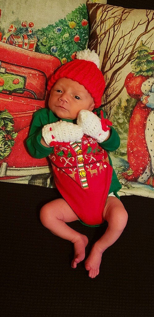 Abel joined the competition — help win amazing prizes! baby, baby_toddler_clothing, child, christmas, christmas_decoration, christmas_eve, christmas_ornament, comfort, event, happy, headwear, holiday, human_leg, lap, ornament, person, red, sleeve, sock, thigh