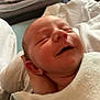 Emma participe au concours pour gagner de l'argent avec cette photo : newborn, baby, infant, sleeping, smiling, hand, blanket, closeup, face, skin, head, resting, comfort, indoors, soft, peaceful, young, portrait, person, cute
