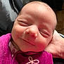 baby, newborn, smiling, face, closeup, sleeping, hand, clothing, purple, soft, cute, infant, peaceful, portrait, resting, human, child, warm, toddler, zipped_jacket