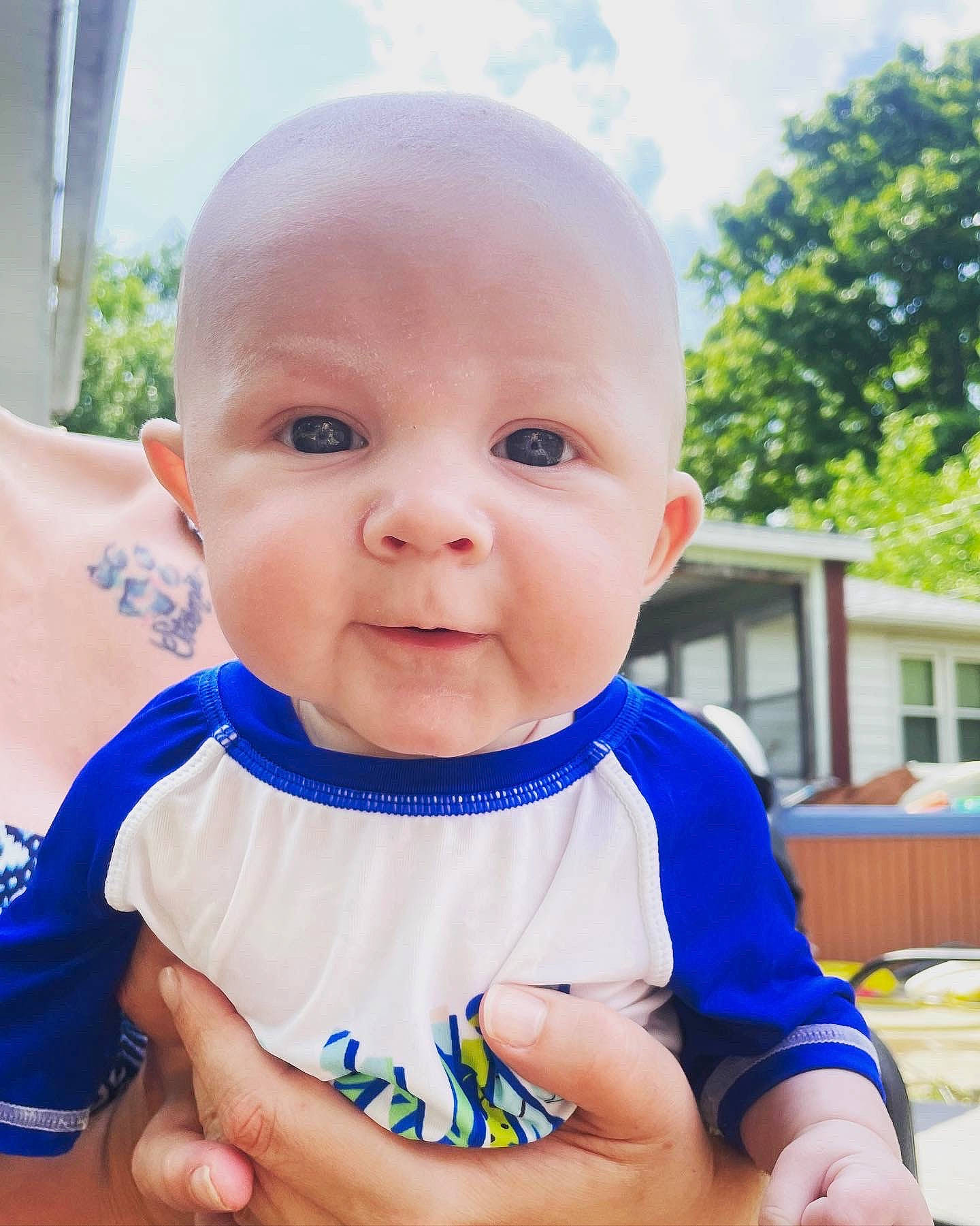Grayson joined the competition — help win amazing prizes! baby, baby_products, baby_toddler_clothing, cheek, child, electric_blue, eye, fun, grass, happy, iris, leisure, people_in_nature, person, sitting, skin, sky, sleeve, smile, toddler