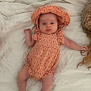 Leia joined the competition — help win amazing prizes! baby, infant, bed, blanket, clothing, bonnet, person, cute, newborn, sleepwear, soft, relaxing, lying_down, indoors, child, small, adorable, pink, fabric, resting