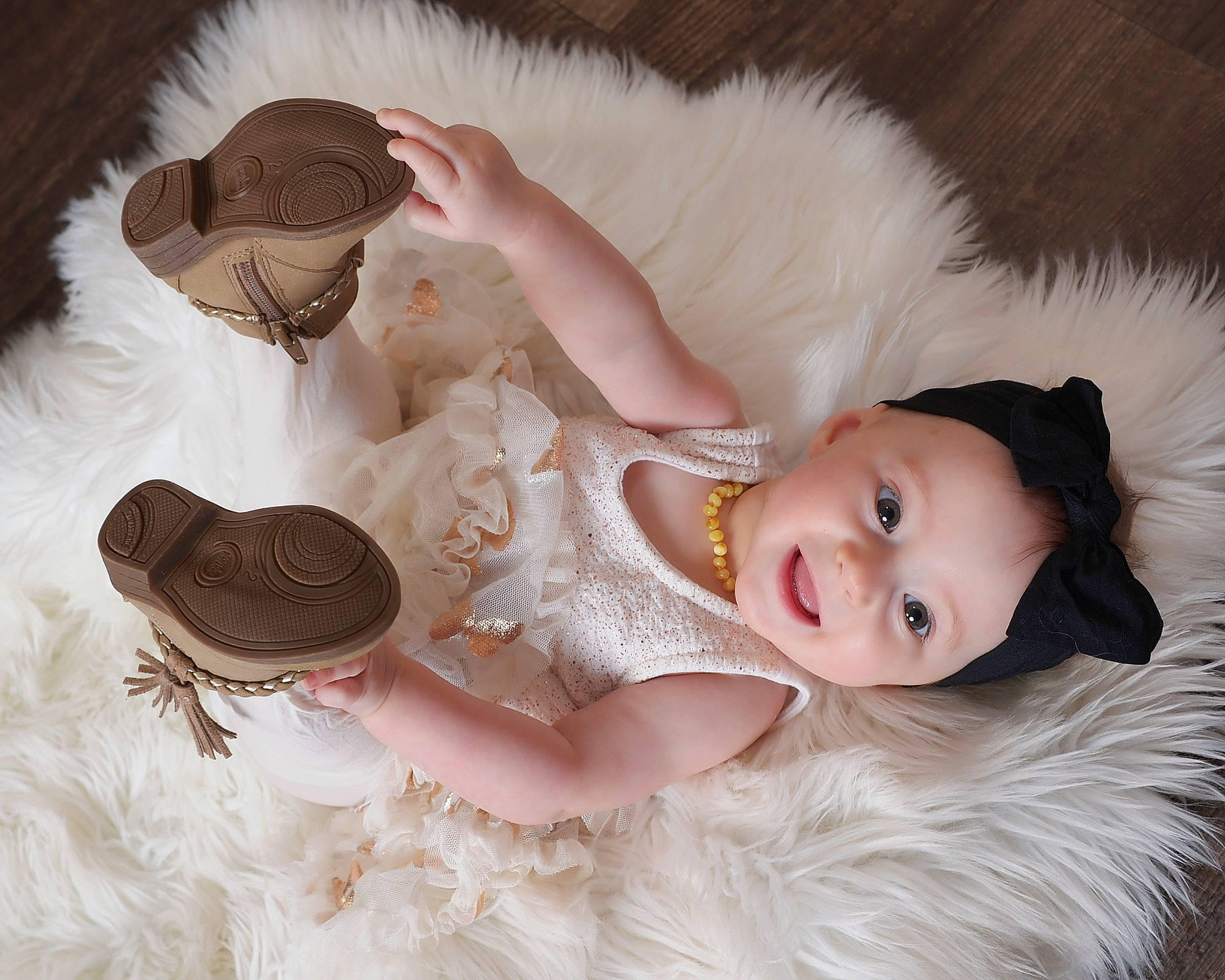 Brynn joined the competition — help win amazing prizes! baby_toddler_clothing, child, ear, embellishment, eye, eyelash, fashion_accessory, fur, fur_clothing, gesture, hair_accessory, happy, hat, headgear, headpiece, person, petal, skin, smile, textile