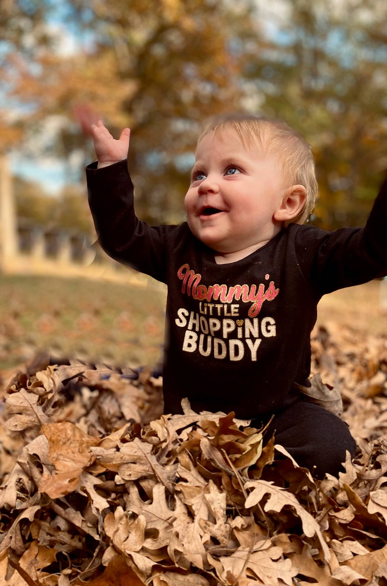 Ryleigh is registered to the contest to win money with this photo: baby, baby_toddler_clothing, child, deciduous, face, flash_photography, fun, gesture, grass, happy, head, people_in_nature, person, plant, smile, soil, t_shirt, toddler, tree, wood