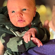 David joined the competition — help win amazing prizes! baby, camouflage, child, closeup, clothing, cute, expression, face, hand, holding, hoodie, indoor, infant, newborn, person, portrait, skin, soft_light, warm, young