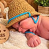 Kaylen is registered to the contest to win money with this photo: newborn, baby, infant, portrait, sleeping, hat, crochet, blanket, teddy_bear, toy_horse, milestone, wooden_sign, two_months, nursery, cozy, brown, blue, close_up, lying_down, plush