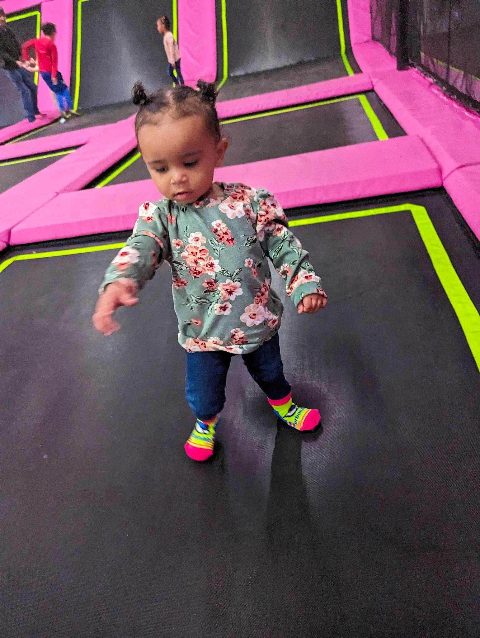 Armani is registered to the contest to win money with this photo: asphalt, baby, carpet, child, entertainment, event, floor, flooring, fun, grass, leisure, magenta, person, pink, playground, purple, recreation, room, toddler, trampolining_equipment_and_supplies