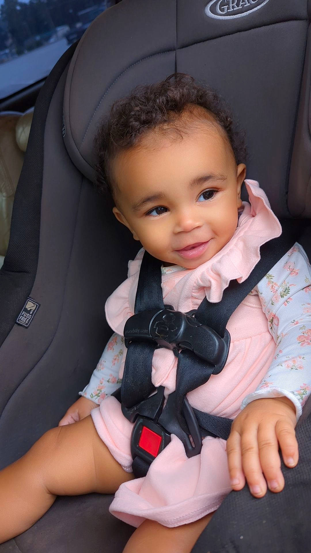 Armani is registered to the contest to win money with this photo: arm, baby, baby_toddler_clothing, car_seat, cheek, comfort, eye, face, facial_expression, finger, flash_photography, gesture, hand, head, joy, person, seat_belt, skin, sleeve, smile