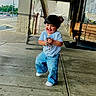 child, toddler, smiling, happy, jeans, tshirt, concrete, sidewalk, urban, building, door, glass, reflection, keys, playful, person, walking, outdoor, daylight, cute