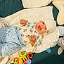 baby, babylaughing, blanket, bonnet, clothing, crib, face, furniture, happy, hat, head, infantbed, laughing, newborn, person, photography, portrait, smile, yawning