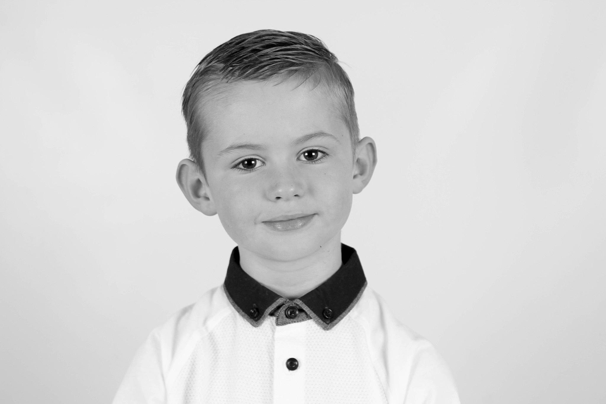 Callum is registered to the contest to win money with this photo: black_and_white, boy, child, gentleman, monochrome, monochrome_photography, neck, person, photograph, photography, portrait, portrait_photography, smile, standing, white