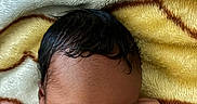 Blessan joined the competition — help win amazing prizes! newborn, baby, sleeping, blanket, soft_texture, curly_hair, infant, peaceful, cute, skin, fist, closeup, portrait, child, resting, colorful, warm, cozy, indoors, toddler