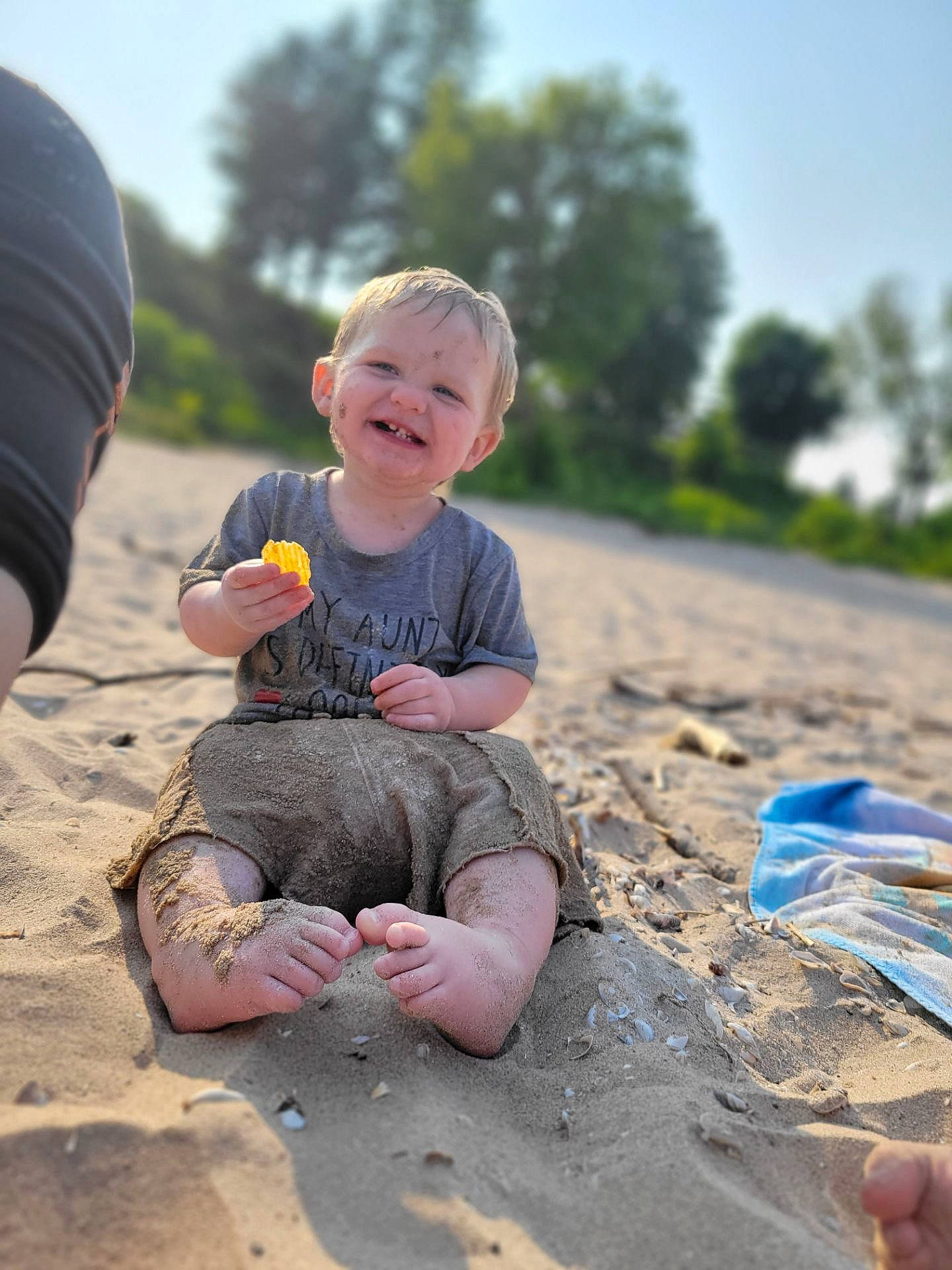 Sylus joined the competition — help win amazing prizes! baby, barefoot, beach, child, flash_photography, fun, grass, happy, joy, leisure, people_in_nature, person, plant, recreation, sitting, sky, smile, soil, t_shirt, toddler