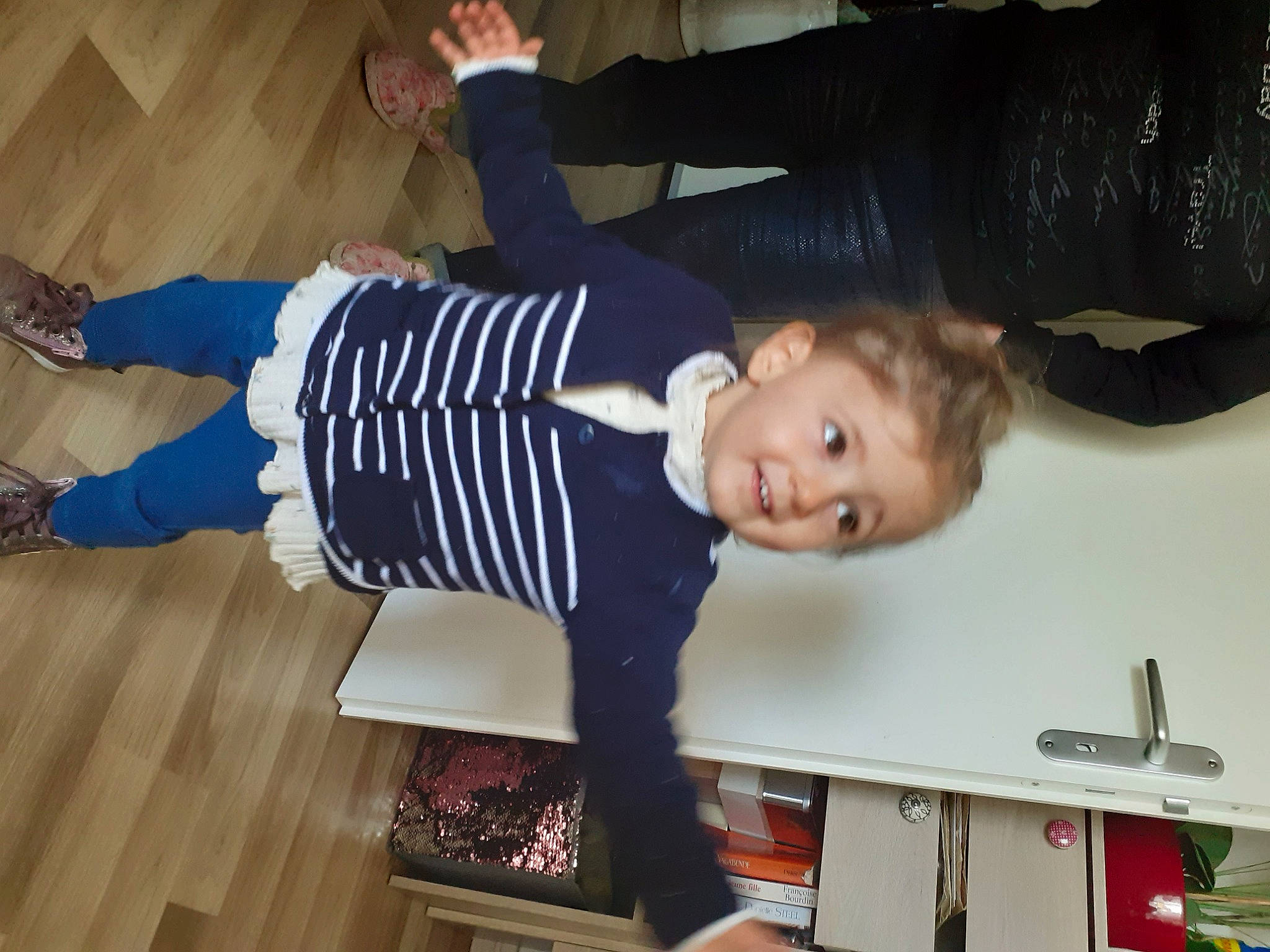 Sophia participe au concours pour gagner de l'argent avec cette photo : arm, baby_toddler_clothing, cabinetry, child, electric_blue, flooring, fun, hardwood, home_appliance, joy, kitchen_appliance, knee, pattern, person, room, smile, sock, standing, toddler, varnish