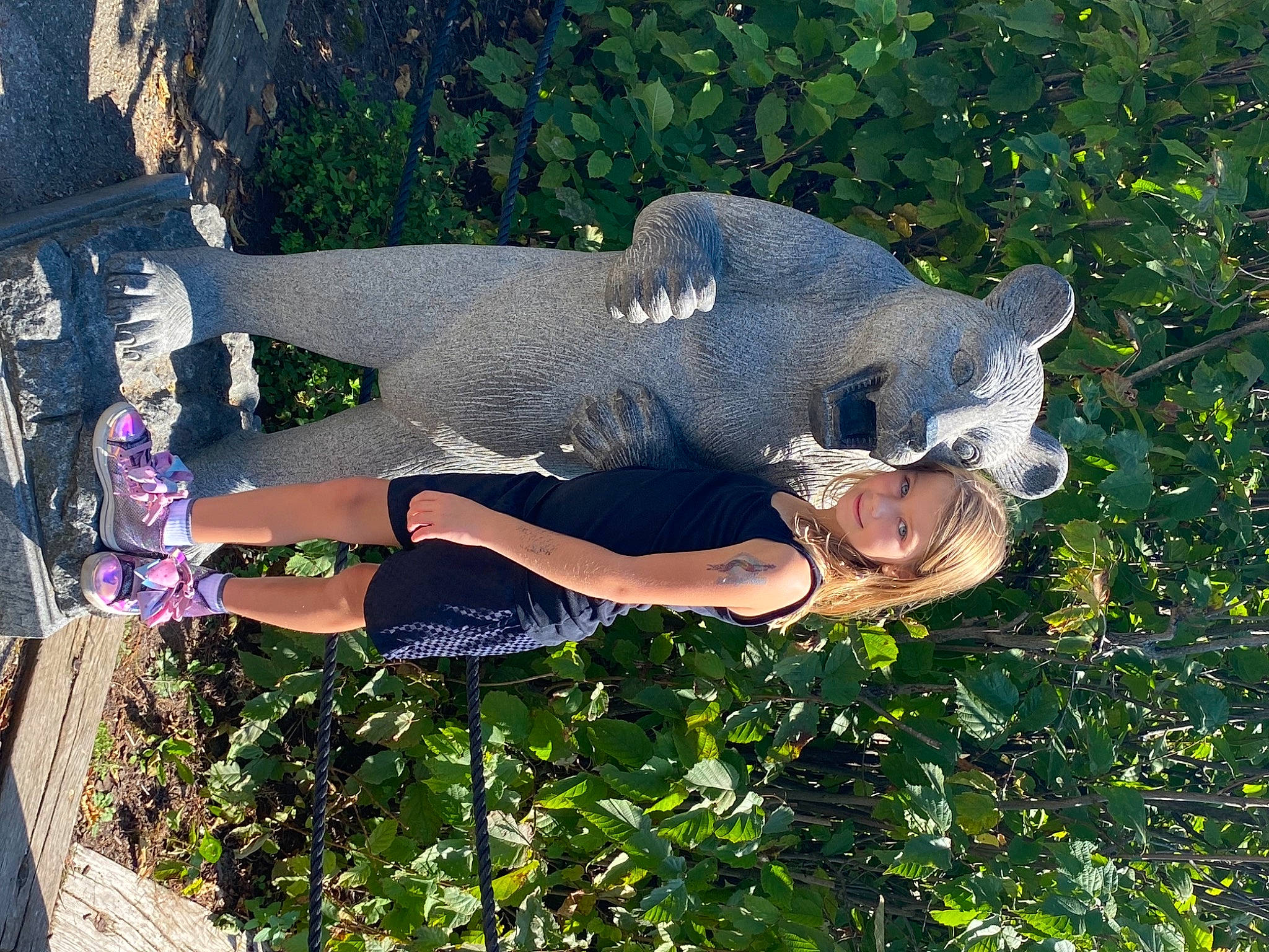 Bella joined the competition — help win amazing prizes! art, fun, garden, grass, happy, human_leg, joy, knee, lawn_ornament, leisure, organism, people_in_nature, person, plant, sculpture, shrub, smile, statue, thigh, tree