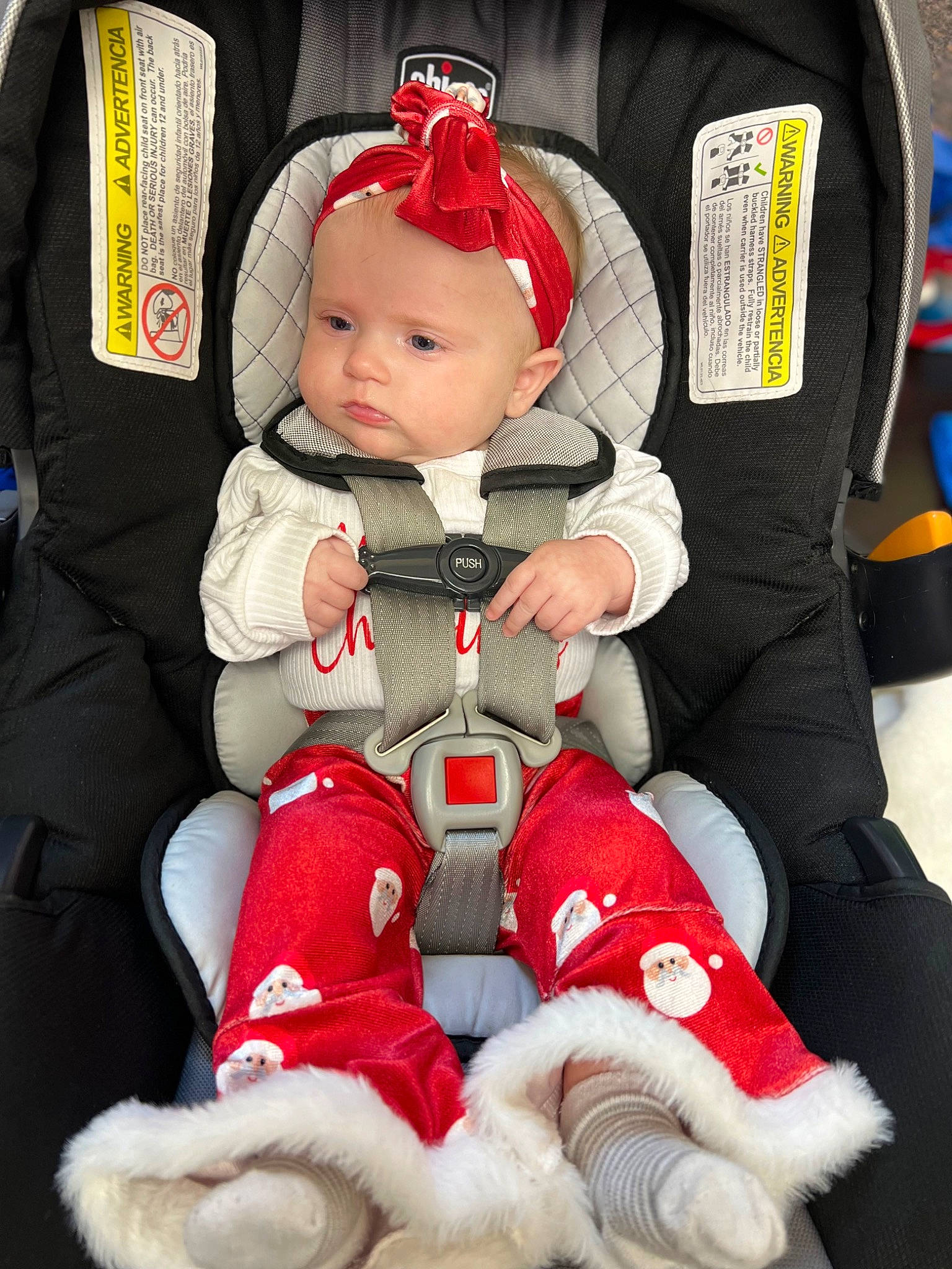 Zoe joined the competition — help win amazing prizes! arm, baby, baby_carriage, baby_products, baby_toddler_clothing, carmine, chair, child, comfort, fashion_accessory, fictional_character, human_body, human_leg, lap, person, personal_protective_equipment, red, sitting, sleeve, thigh