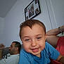 blue_shirt, casual, child, closeup, couch, family, happy, home, indoors, living_room, man, people, person, photograph, portrait, relaxing, seated, smile, toddler, wall_art