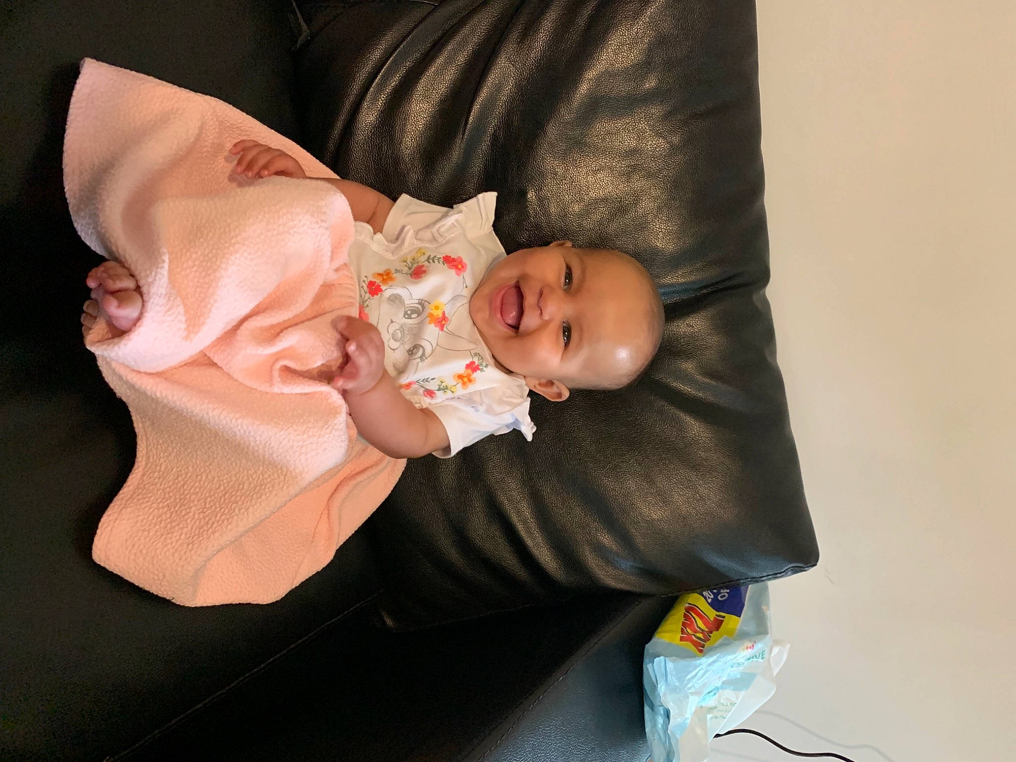 Inaya a rejoint le concours — aidez-le/la à gagner de superbes lots ! baby, baby_carriage, baby_products, baby_toddler_clothing, blond, cheek, child, comfort, dress, eye, finger, human_body, iris, joy, linens, person, sitting, skin, sleeve, smile