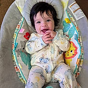 Scarlett joined the competition — help win amazing prizes! baby, infant, smile, happy, onesie, cartoon_print, baby_seat, colorful, indoor, child, cute, young, comfort, playful, sitting, padded, face, hands, bright_eyes, joy
