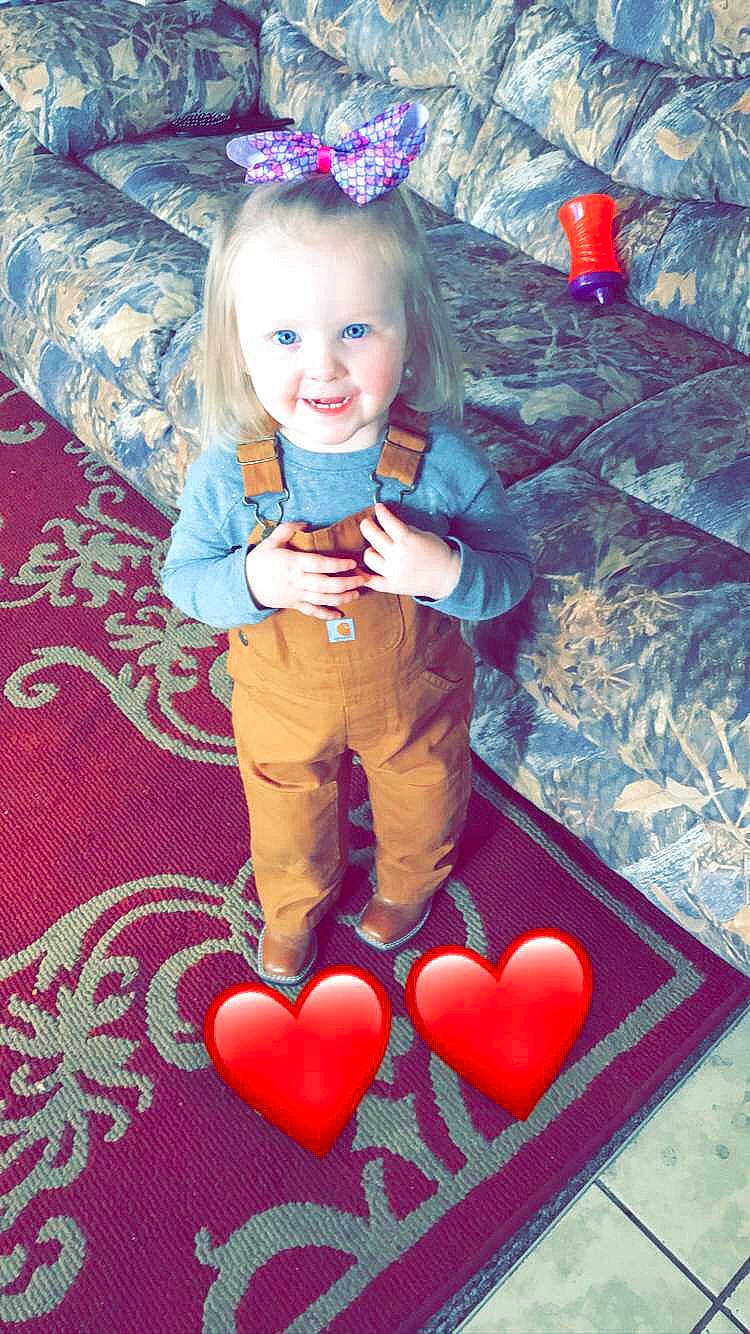 Preslee is registered to the contest to win money with this photo: baby_toddler_clothing, blue, eye, face, facial_expression, fun, hair, happy, head, human_body, joy, leg, organ, person, photograph, pink, red, sleeve, smile, textile