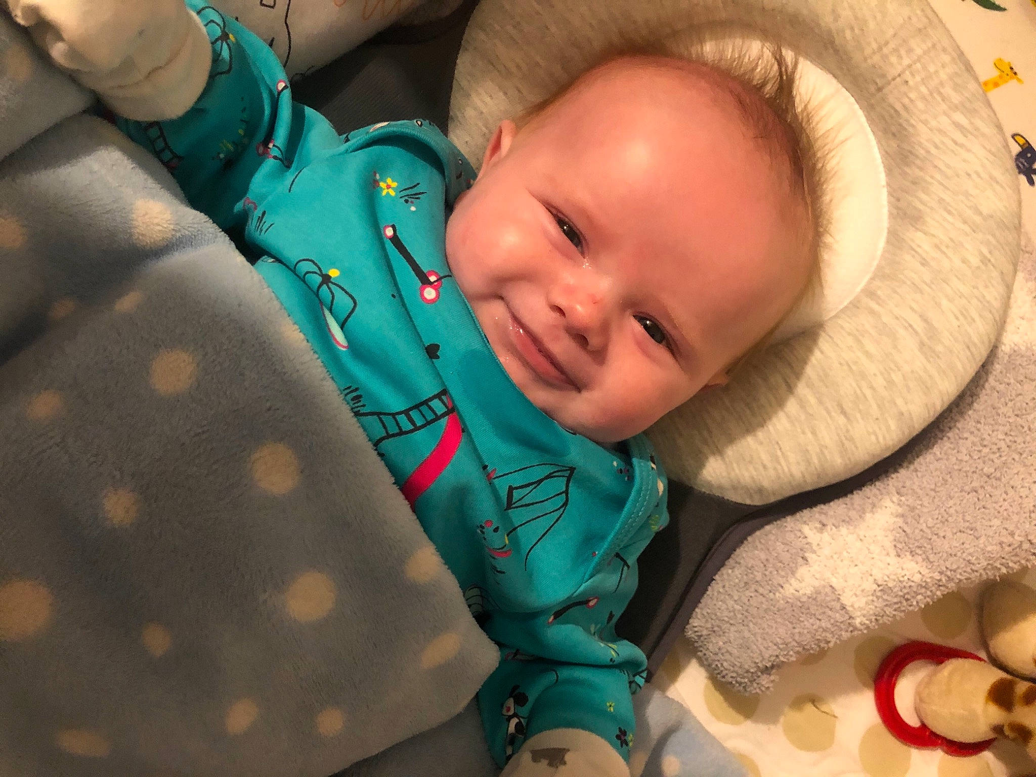 Teddy is registered to the contest to win money with this photo: baby, baby_carriage, baby_products, baby_sleeping, baby_toddler_clothing, blue, cheek, child, comfort, finger, happy, linens, mouth, nose, pattern, person, skin, smile, textile, toddler