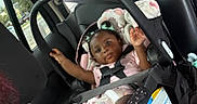 Aylani is registered to the contest to win money with this photo: baby, car_seat, child, infant, seatbelt, car_interior, blanket, window, doll, hair, clothing, seat, safety, child_safety, person, vehicle, curious, candid, indoors, casual