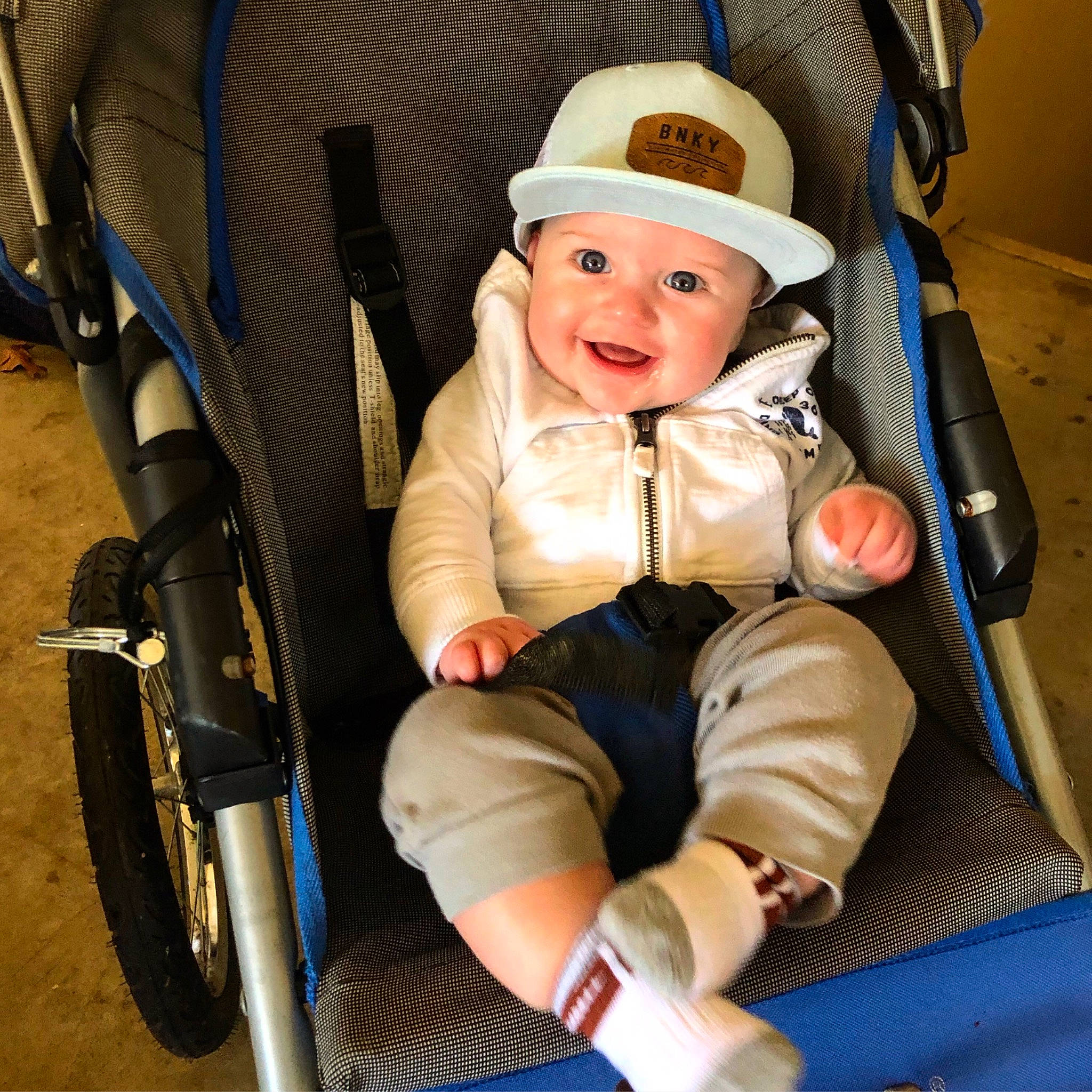 Brock is registered to the contest to win money with this photo: baby, baby_carriage, baby_products, baby_safety, baby_toddler_clothing, bicycle_accessory, bicycle_part, bicycle_tire, bicycle_wheel, bicycle_wheel_rim, bonnet, child, comfort, costume_accessory, headwear, lap, person, product, sitting, synthetic_rubber