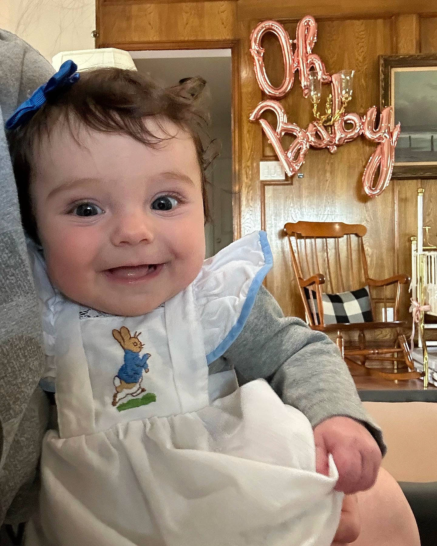 Eve is registered to the contest to win money with this photo: baby, baby_toddler_clothing, blond, blue, chair, cheek, child, comfort, dress, eyebrow, fun, hand, happy, iris, joy, person, skin, sleeve, smile, toddler