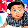 baby, child, birthday, cake, balloons, blue, red, hat, pinstripe, black_clothing, celebration, party, cute, portrait, face, smiling, happy, infant, indoor, colorful