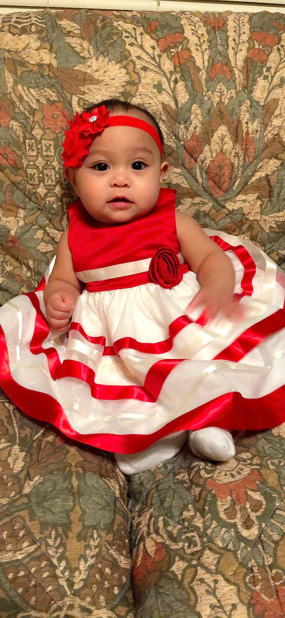 Mary Elizabeth is registered to the contest to win money with this photo: child, girl, hair_accessory, headgear, infant, person, red, textile, toddler