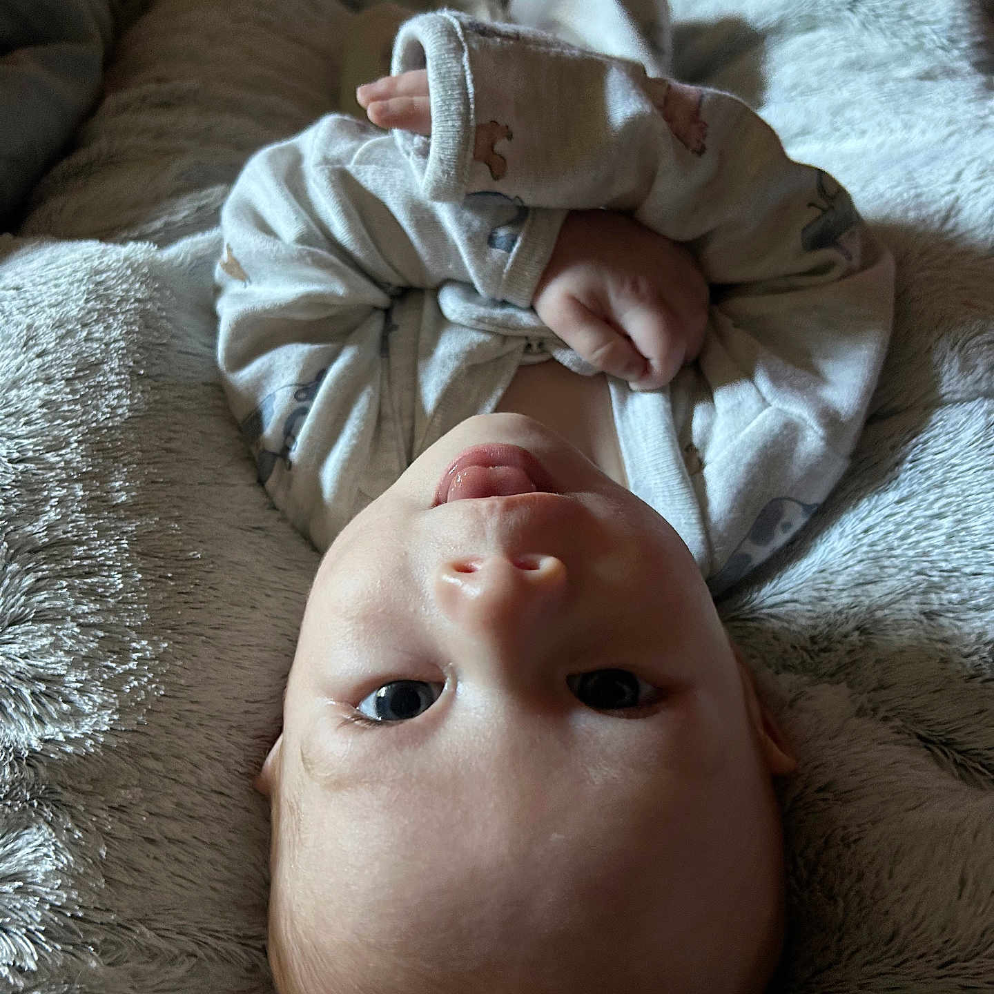 Kendan joined the competition — help win amazing prizes! baby, blanket, clothing, cozy, cute, expression, face, hand, head_support, human, indoor, infant, lying_down, newborn, portrait, skin, sleepwear, soft_texture, toddler, young_child