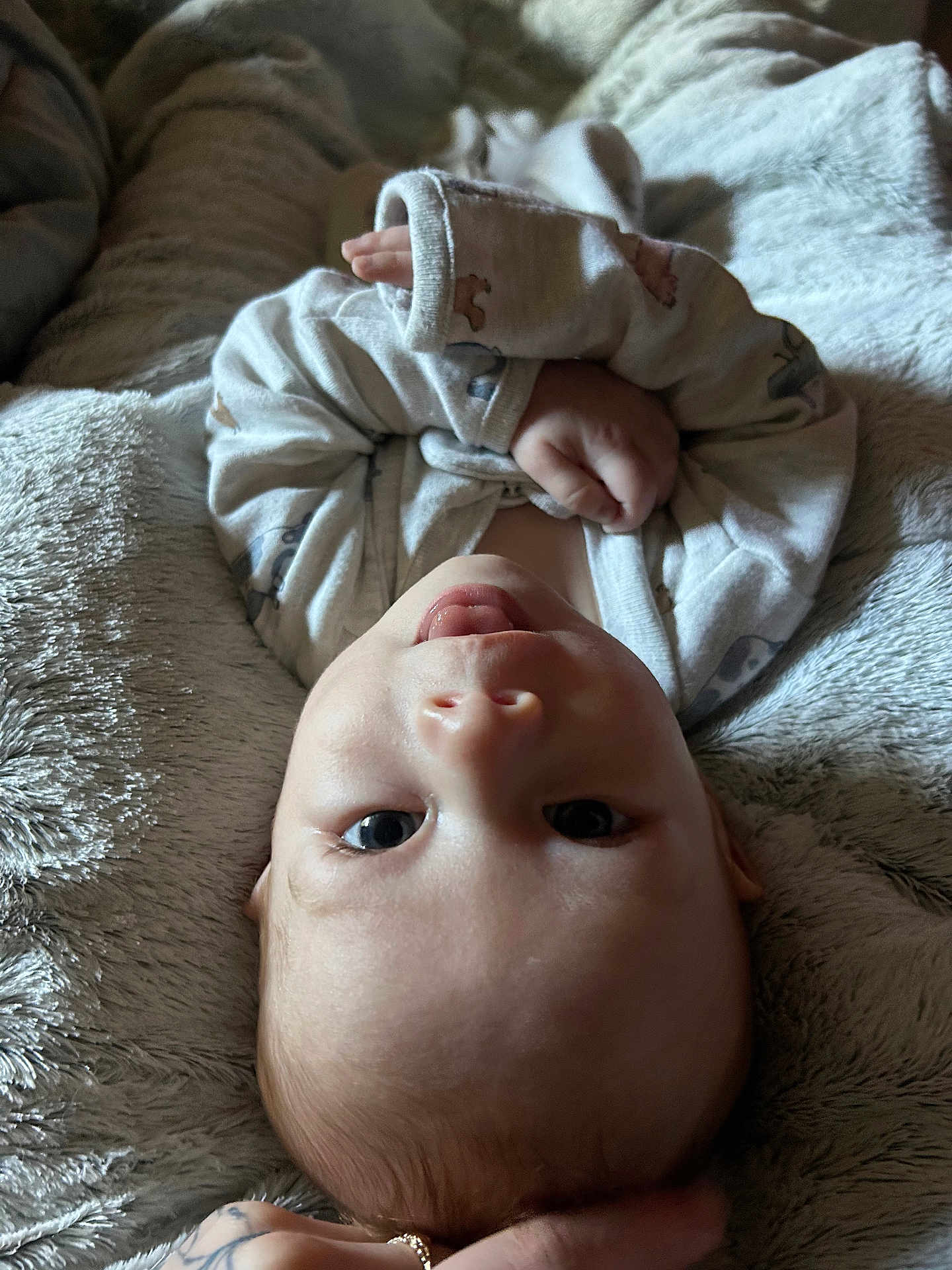 Kendan joined the competition — help win amazing prizes! baby, infant, blanket, soft_texture, hand, clothing, cute, portrait, face, skin, newborn, lying_down, indoor, expression, young_child, head_support, cozy, sleepwear, human, toddler