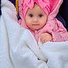baby, infant, child, portrait, pink, hood, headband, bow, blanket, bundled_up, stroller, winter_clothing, cute, eyes, face, indoors, sitting, cozy, smiling, close_up