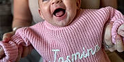 Jasmine joined the competition — help win amazing prizes! adult, baby, child, clothing, cozy, cute, face, hands, happy, holding, indoor, jasmine, knitted, legs, name, person, pink_sweater, portrait, sitting, smiling