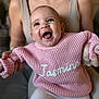 Jasmine joined the competition — help win amazing prizes! baby, child, smiling, pink_sweater, knitted, name, jasmine, happy, person, adult, holding, hands, face, portrait, indoor, cute, cozy, clothing, sitting, legs