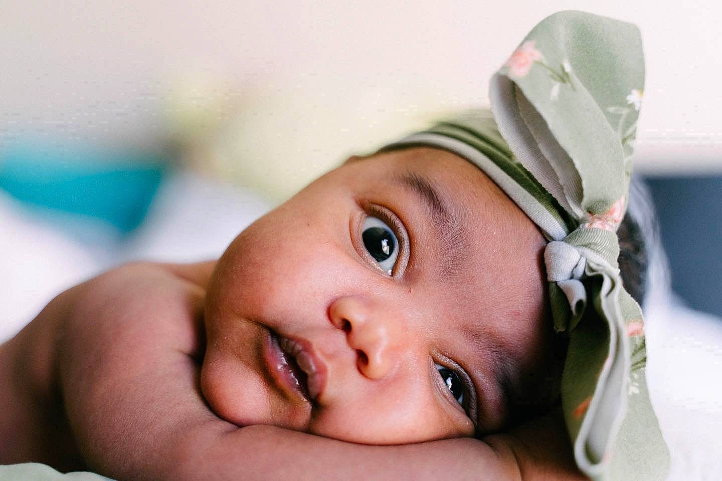 Jurnee is registered to the contest to win money with this photo: baby, cap, cheek, comfort, dress, eye, eyebrow, eyelash, fashion_accessory, flash_photography, fun, gesture, happy, headwear, iris, lip, mouth, nose, person, skin