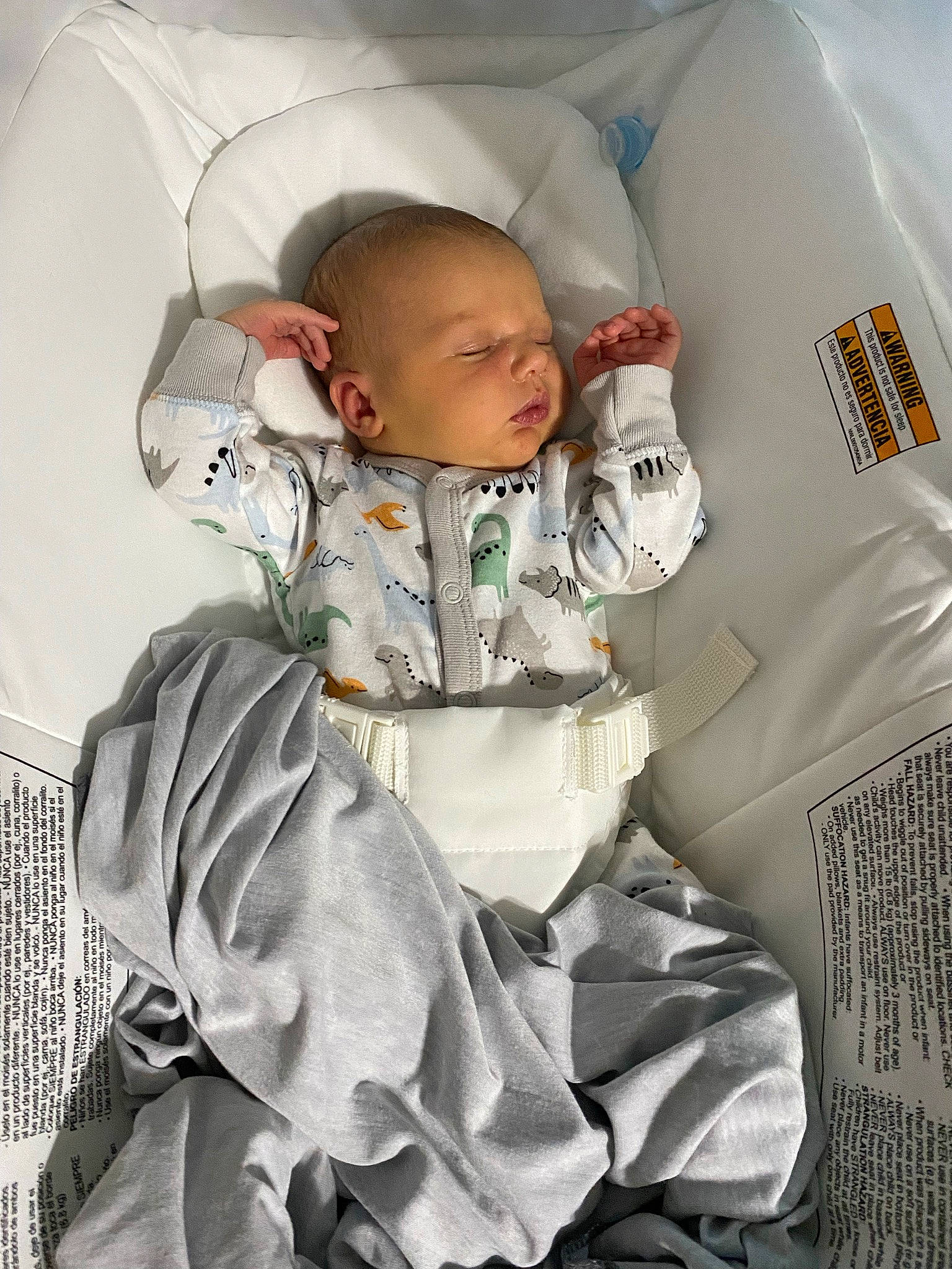 Colin is registered to the contest to win money with this photo: baby, baby_products, baby_safety, baby_sleeping, baby_toddler_clothing, camouflage, car_seat, child, comfort, fashion_design, gesture, linens, military_camouflage, outerwear, pattern, person, sitting, sleeve, t_shirt, toddler