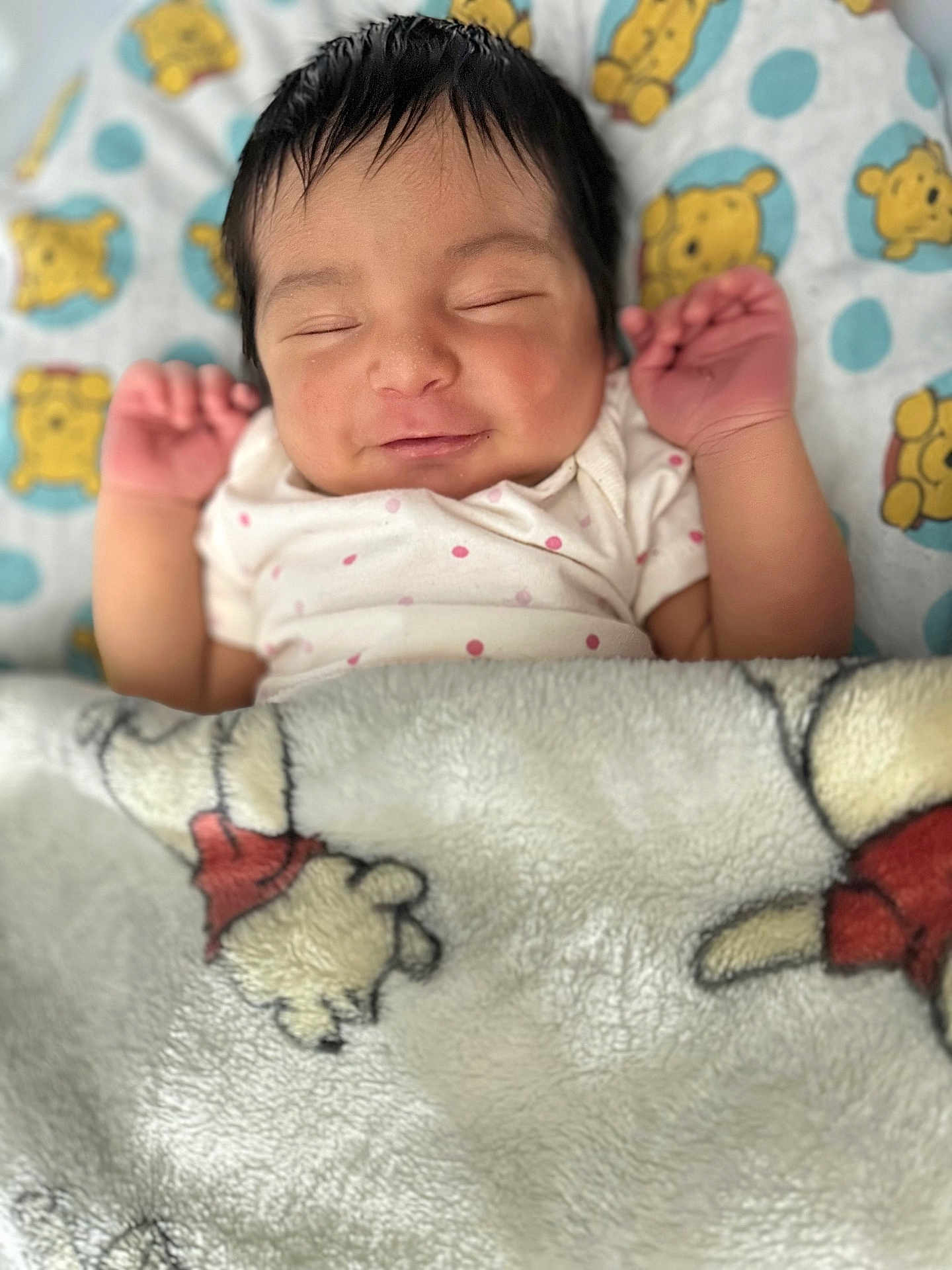 Serenity is registered to the contest to win money with this photo: baby, sleeping, blanket, pillow, winnie_the_pooh, cartoon, child, infant, face, smile, hands, bedtime, cozy, soft, cute, resting, indoors, clothing, portrait, peaceful