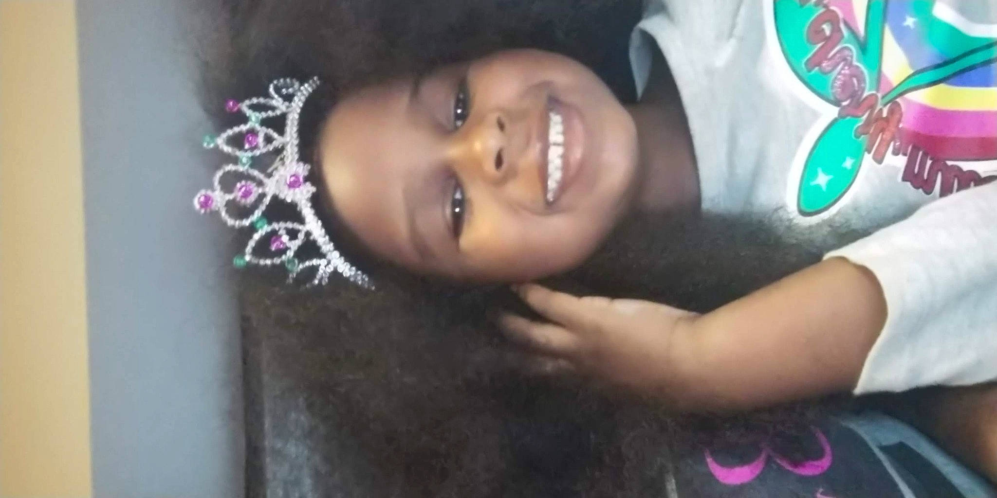 Layla is registered to the contest to win money with this photo: baby, black_hair, cap, cheek, close_up, eye, eyebrow, flash_photography, fun, happy, hat, head, human_body, joy, lip, mouth, nose, person, pink, skin