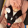 Lilith is registered to the contest to win money with this photo: baby, infant, sleeping, car_seat, pink_clothing, headband, bow, pacifier, safety_harness, cozy, cute, child, newborn, soft_fabric, mittens, leggings, portrait, indoor, resting, peaceful