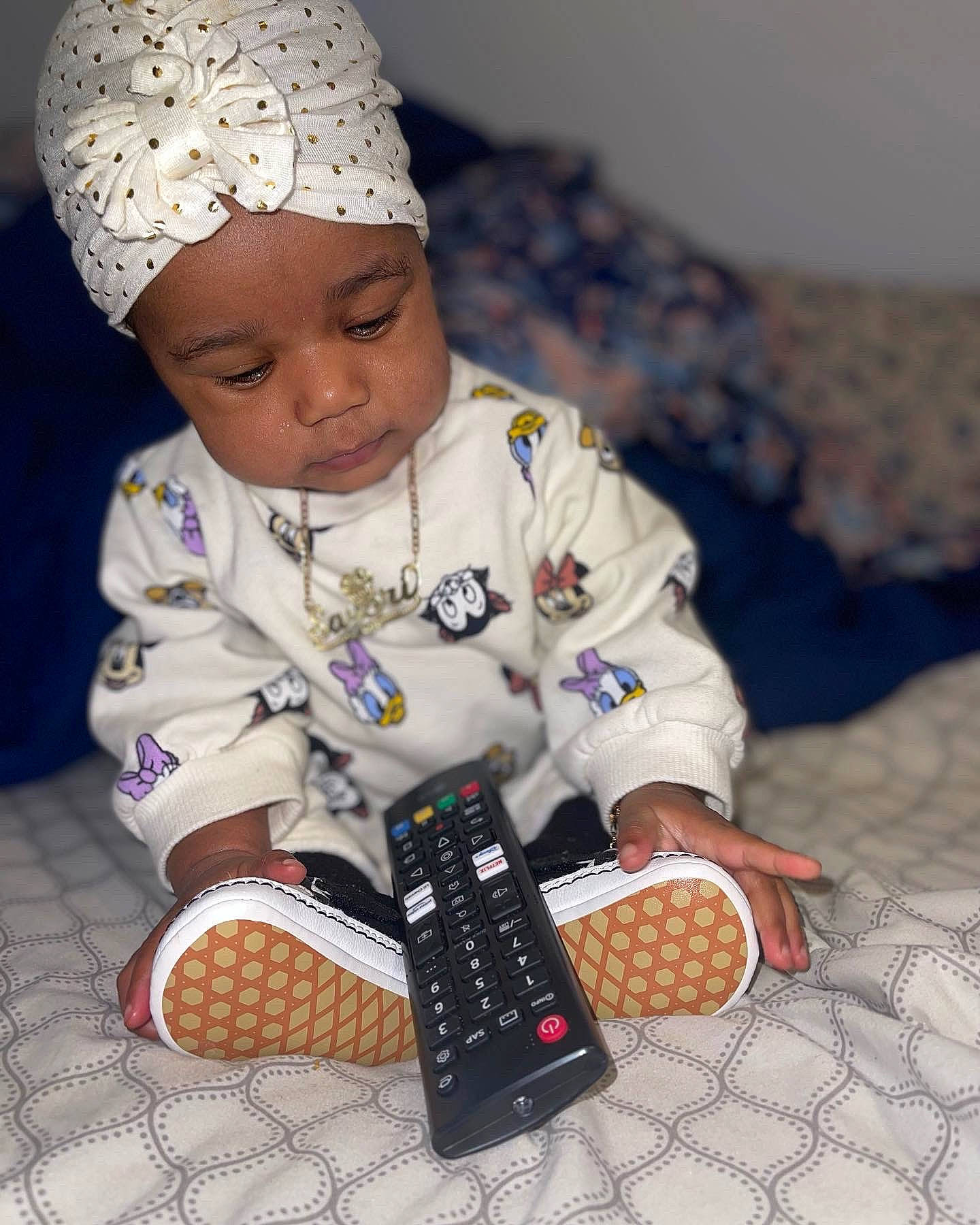 Sayori is registered to the contest to win money with this photo: baby, baby_toddler_clothing, book, cap, child, event, finger, gadget, hand, happy, hat, headwear, holiday, knit_cap, nail, office_equipment, pattern, person, sleeve, textile