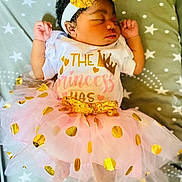 Sekani joined the competition — help win amazing prizes! baby, baby_toddler_clothing, beauty, cap, child, dress, event, face, happy, hat, headband, headpiece, orange, pink, product, sugar_cake, sweetness, textile, toddler, yellow