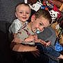 Lane joined the competition — help win amazing prizes! child, toddler, couch, pacifier, smiling, indoor, clothing, jeans, tshirt, furniture, playful, cute, happy, living_room, home, wooden_wall, laundry, pile, person, face